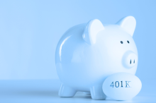 Light blue piggy bank with a blue rock that reads 401k